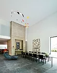 The ground floor includes a double-height dining room.
