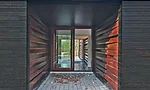 Covered porch lined in board-and-batten.