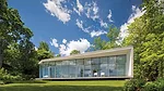 The house is designed so that the living-dining area and the master bedroom overlook the water. 