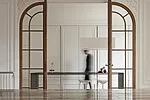 In a Paris apartment, i29 Interior Architects concealed most of the kitchen behind MDF doors covered in decorative panels.