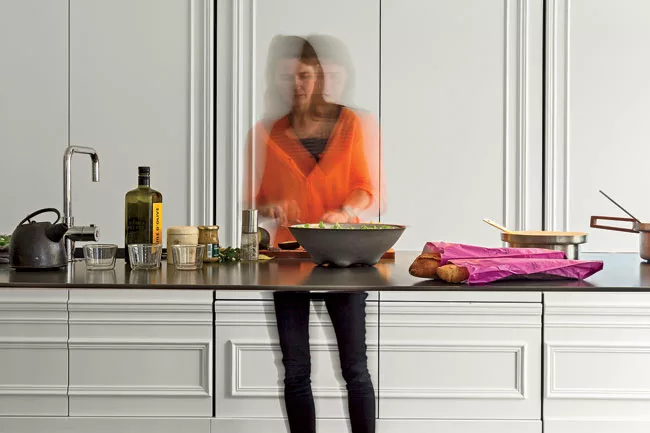  The sole clue that the table&mdash;which appears to be less than an inch thick when viewed from the front&mdash;is a functioning work top is a minimalist faucet.