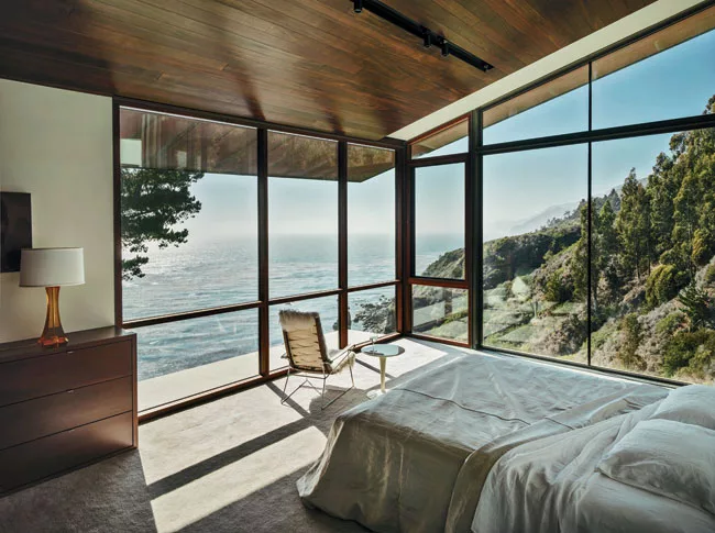 The master bedroom cantilevers out over the bluff, making the view of the coastline the primary focus.
