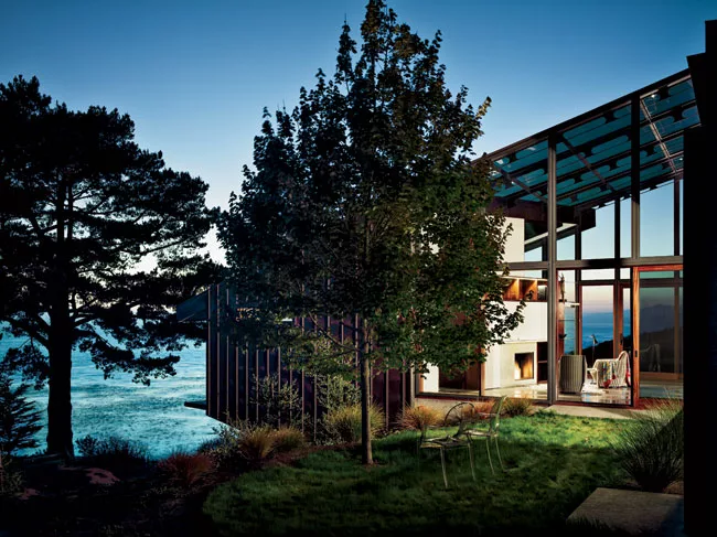 A glass library has two views: one of sky and sea, the other of an intimate terrace.