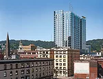 By combining CFD analyses and wind-tunnel tests, designers from ZGF determined the optimal configuration for turbines to be mounted on the roof of this mixed-use high-rise.