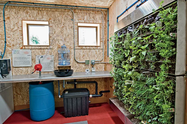 In addition to the clearly visible structure, its teaching tools include a living wall fed by treated graywater.