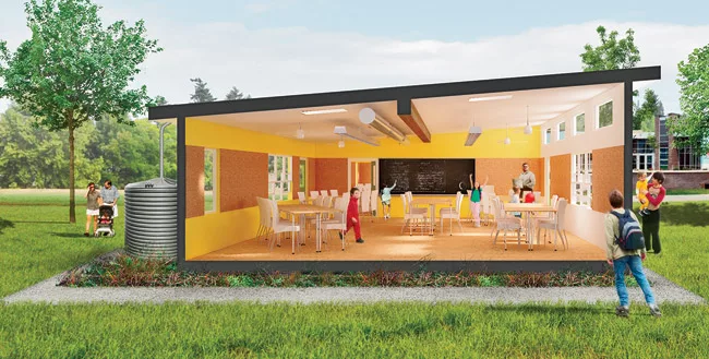 The classroom features clerestory windows to enhance daylighting, exposed ductwork, and a clearly evident flitch beam supporting the roof.