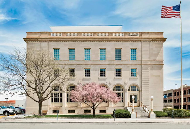 The rooftop PV array, barely visible from the west side of the building (shown), was designed so that it wouldn&rsquo;t impinge on views of the southern, principal facade.