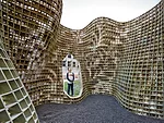 The pavilion, called Bloom, is made up of 840 individual bricks, which form a lacy floral pattern when joined together.
