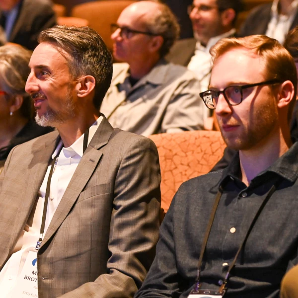 attendees viewing presentation at innovation conference