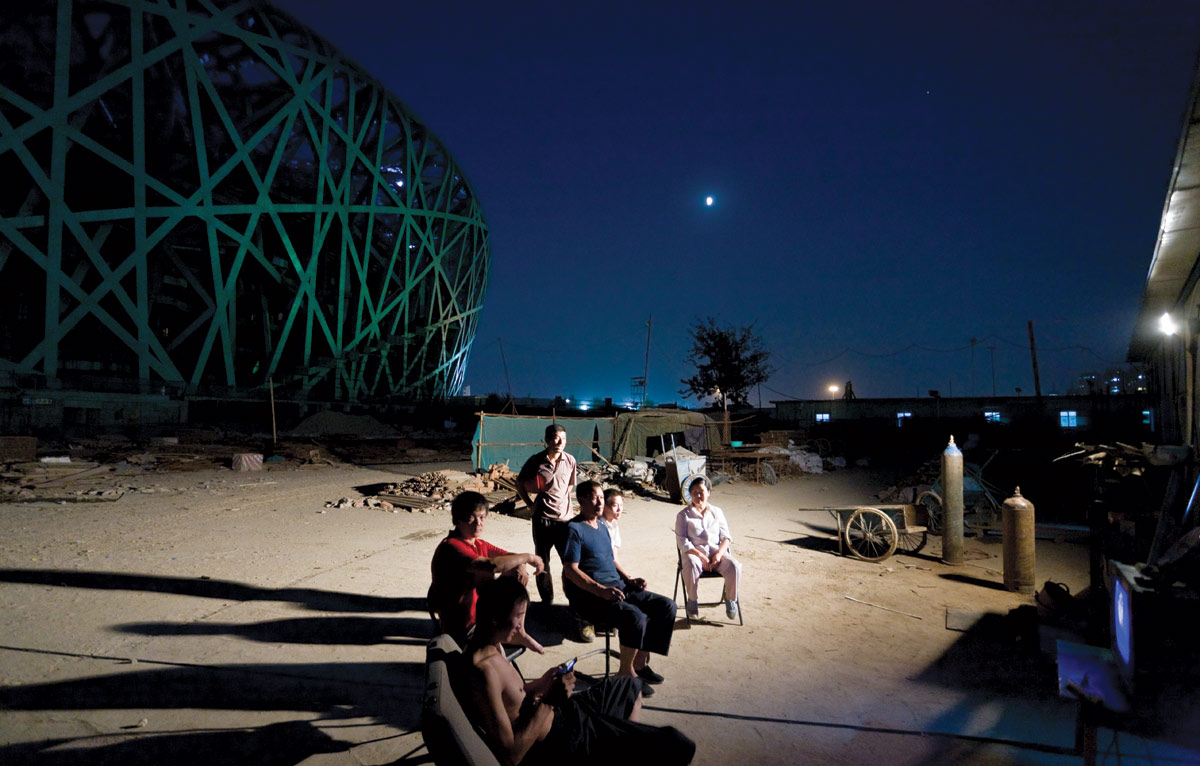 <br><h9>National Stadium by Herzog & de Meuron<br>Beijing, photo by Iwan Baan, 2007</h9><p>   </p><h6><strong>IWAN BAAN</strong><br>
Photographer based in Amsterdam<p>   </p>I don’t like to be thought of as an architectural photographer. My
background is in using photography to tell stories about people and
places. Since I met Rem Koolhaas 13 years ago, I’ve been surrounded
by architects and architecture, but my way of doing photography
hasn’t really changed. Buildings and cities are the backdrops now, but
I’m still focused on how people live.<p>   </p>
Even with a building I don’t like, I can still tell an interesting story.
For example, I don’t find the Burj Khalifa, the tallest building in the
world, particularly interesting, but the context—a row of buildings
rising out of the desert, with one trying to be taller than the others—
is compelling. I recently shot two projects by Herzog & de Meuron.
One is a cultural center in Hong Kong, in an incredibly dense setting.
The other is a large new development near Moscow, in a vast, open
landscape. The contexts couldn’t be more different.<p>   </p>
I divide my time between commissioned work and longer-term
projects. Tatiana Bilbao and I have just completed a collaboration with
11 universities in the U.S. and Mexico in which we looked at various
issues involving the border. It will be a book from Lars Müller and an
exhibition at Yale—both called <em>Two Sides of the Border</em>.<p>   </p>
I use Canon 35-millimeter handheld cameras with a range of lenses.
I don’t use tilt-shift lenses very much, because they’re about taking a
building out of context and framing it perfectly, which is exactly what
I don’t want to do. I use my iPhone a lot—I have more than 130,000
followers on Instagram—and I can’t wait for the day when the phone
is all I need to carry.</h6>