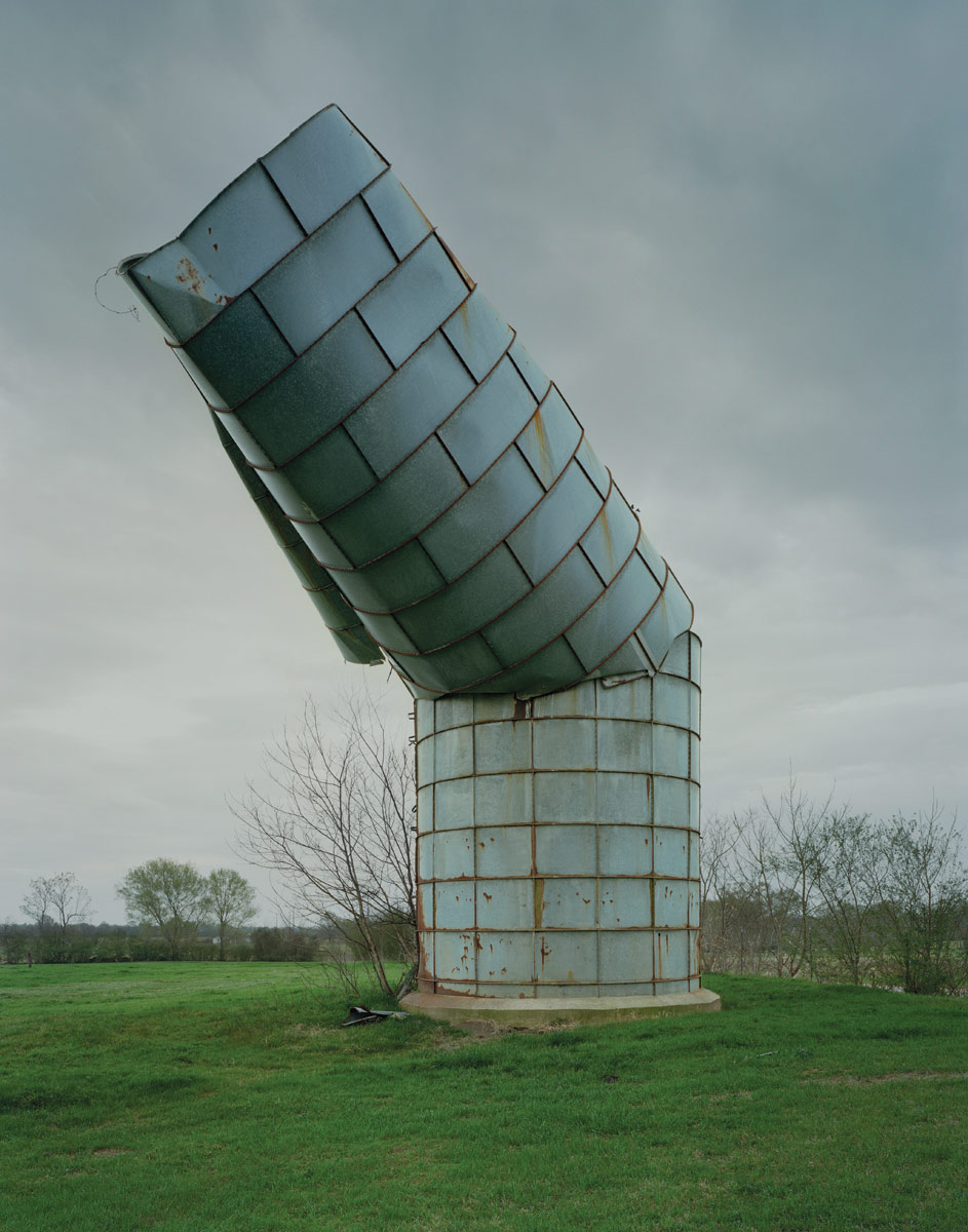 <br><h9>Alabama Silo<br>Greensboro, Alabama, photo by Timothy Hursley, 2008</h9><p>   </p><h6><strong>TIMOTHY HURSLEY</strong><br>
Photographer based in Little Rock, Arkansas<p>   </p>I’ve shot intentional architecture
all over the world, but I also like to
shoot less-intentional architecture.
These days, I’m doing one series on
the funeral homes of the South,
and another on decrepit industrial
buildings. If I’m on the road for a
job, I extend my time. Whenever I
can, I drive somewhere from Little
Rock. I prefer to be out on a cloudy
day. It makes things more photographable;
you’re not fighting the
sun. In one town, I saw a dog food
factory that was being taken
down; it looked like something
BIG would have designed. My
photo ended up in the Oxford
American magazine.<p>   </p>
I started out when I was 17, as
an apprentice to [Detroit-based
architecture, art, and landscape
photographer] Balthazar Korab; I
just sort of fell into it. I’ve been
shooting the Rural Studio [Auburn
University’s design-build program
out of Alabama] since day one, and
I shot things like the construction
of Yoshio Taniguchi’s MoMA from
2004 to 2008; they flew me up to
New York 14 times for that. I used
a view camera all my life. Now I
use a Phase One back (which enables
cameras designed to use film
to take digital photographs): you
put it on a technical camera, with
Rodenstock lenses. If I want to
shoot people in dimmer conditions,
I pull out a Sony DSLR.<p>   </p>
I recently found a funeral home
with eight abandoned caskets; it
was dark, so I used two iPhone
flashlights, and I got a really cool
shot. Not long ago, I bought a
broken silo near the Rural Studio
buildings in Alabama, and I put up
a surveillance camera, which I set
to shoot once every 12 seconds—I
was getting thousands of images a
day. It was great to find an interesting
object and not have to be
like Ansel Adams. Set it up and
walk away.</h6>