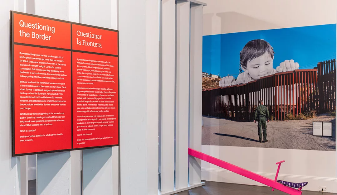 The Wall / El Muro photography and a bright pink teeter-totter