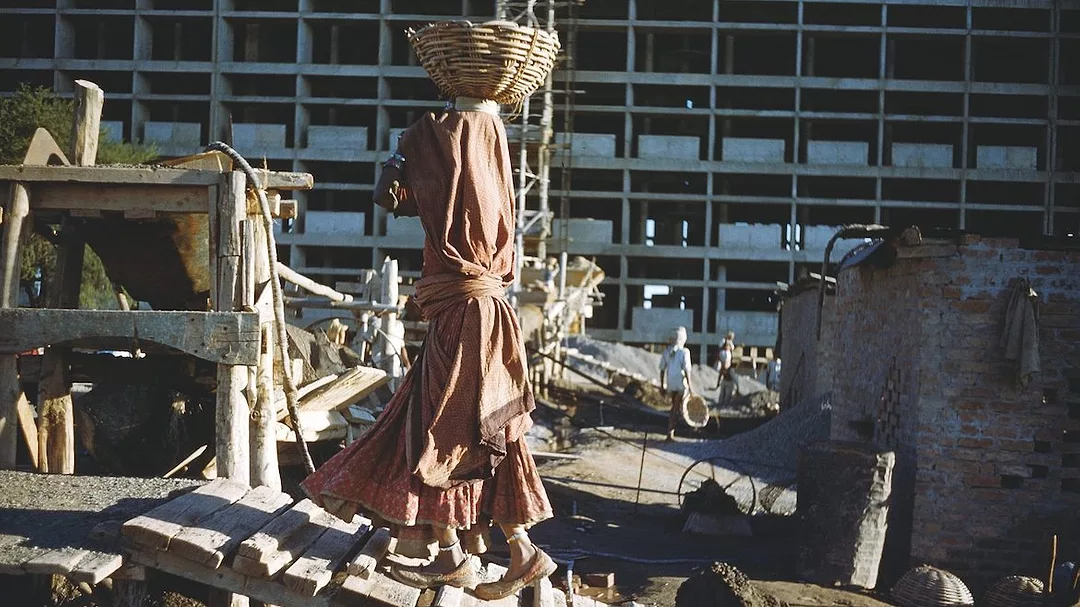Woman carrying cement at Chandigarh.