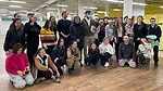 Shigeru Ban with the volunteers who installed the partition system in Poland.