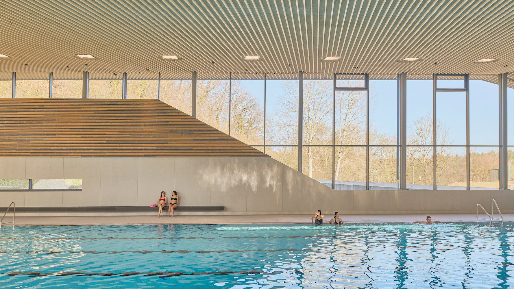 Behnisch Arkitekten's Schwaketenbad Aquatic Center Puts a Pool-Packed Program Under Three Distinctive Roofs