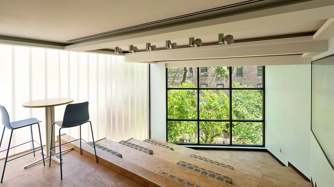 a light-filled room with tiered seating
