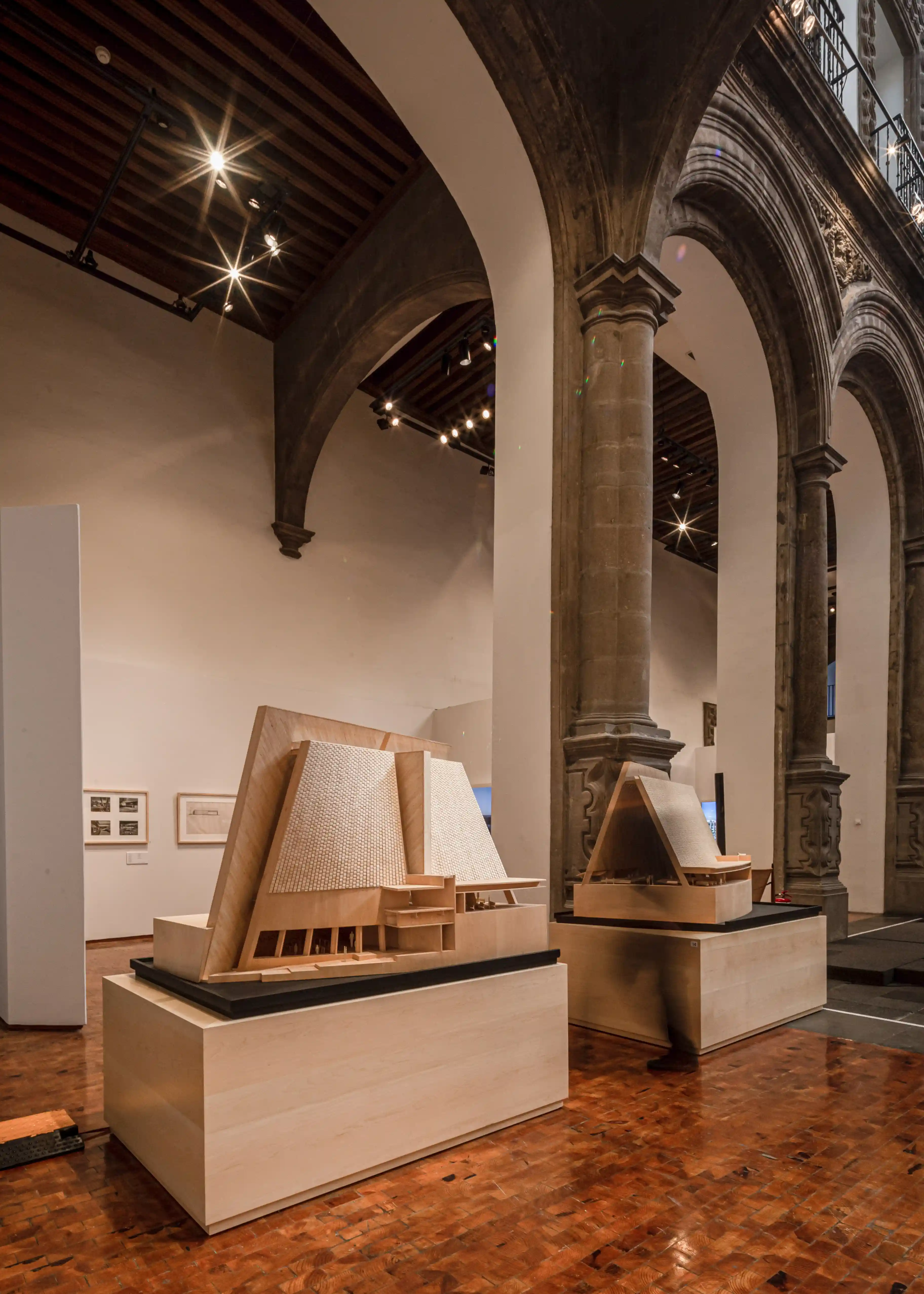 installation view of an architecture exhibition in a historic space.