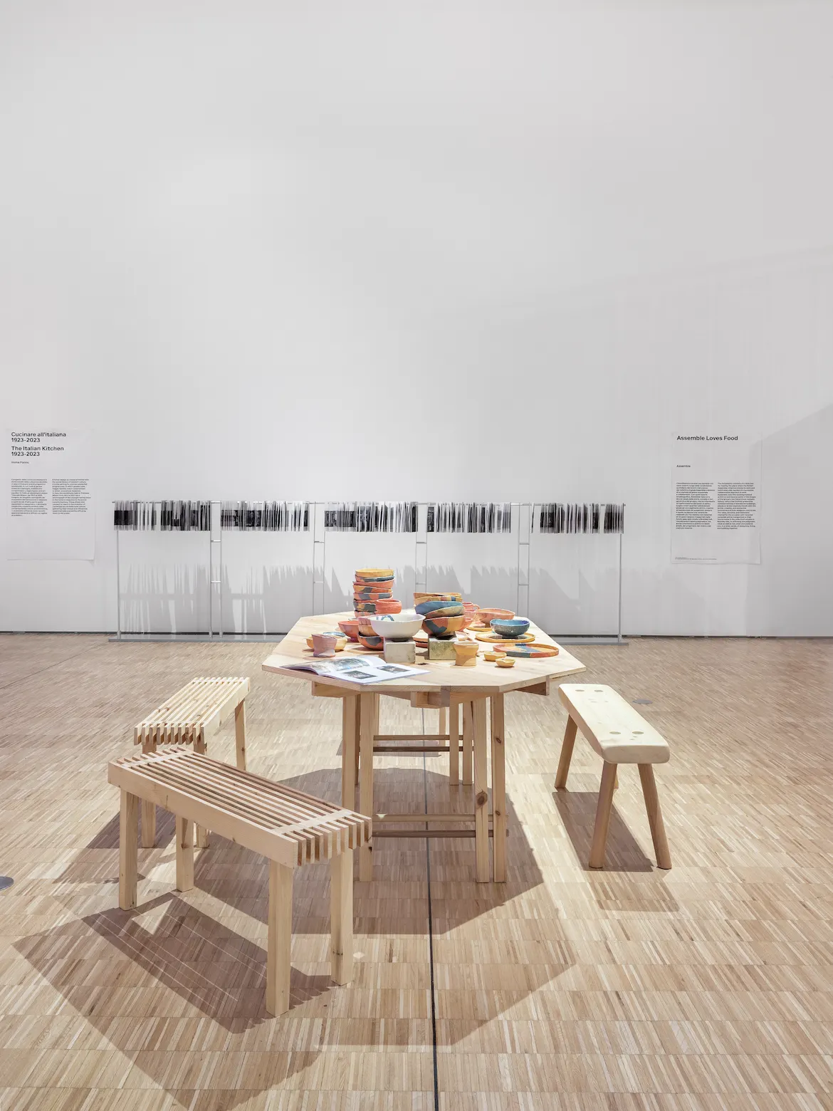 a museum installation featuring a kitchen table scene
