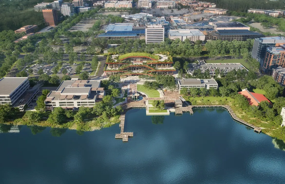aerial rendering of buildings along a lake in columbia, maryland.