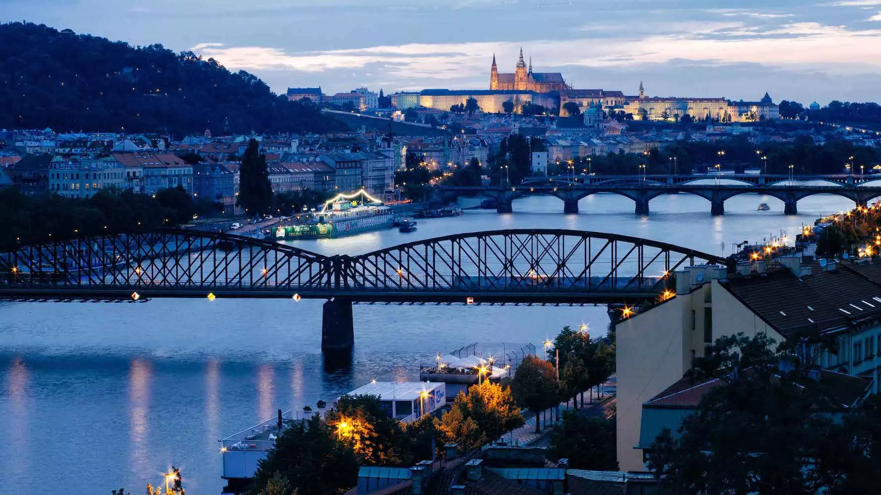 view of bridges spanning a river in prague