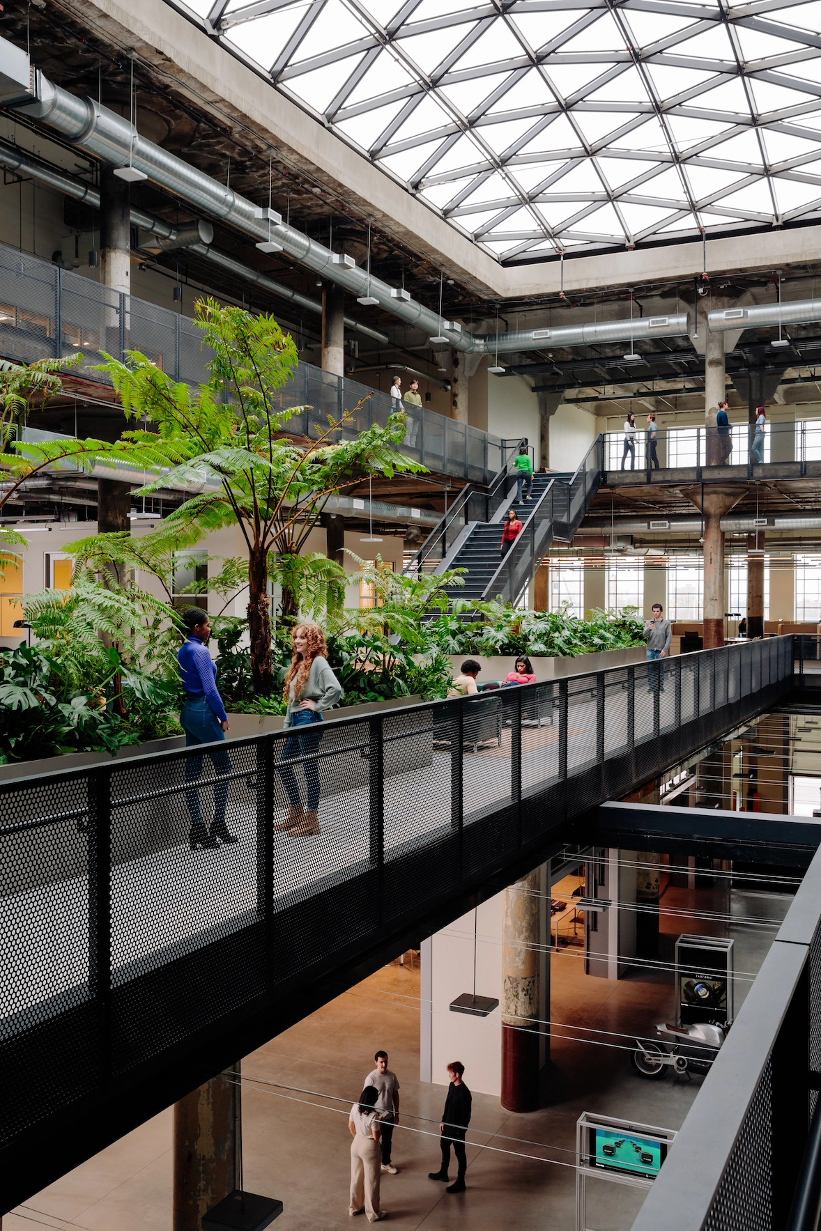 a daylit atrium in a large industrial space.