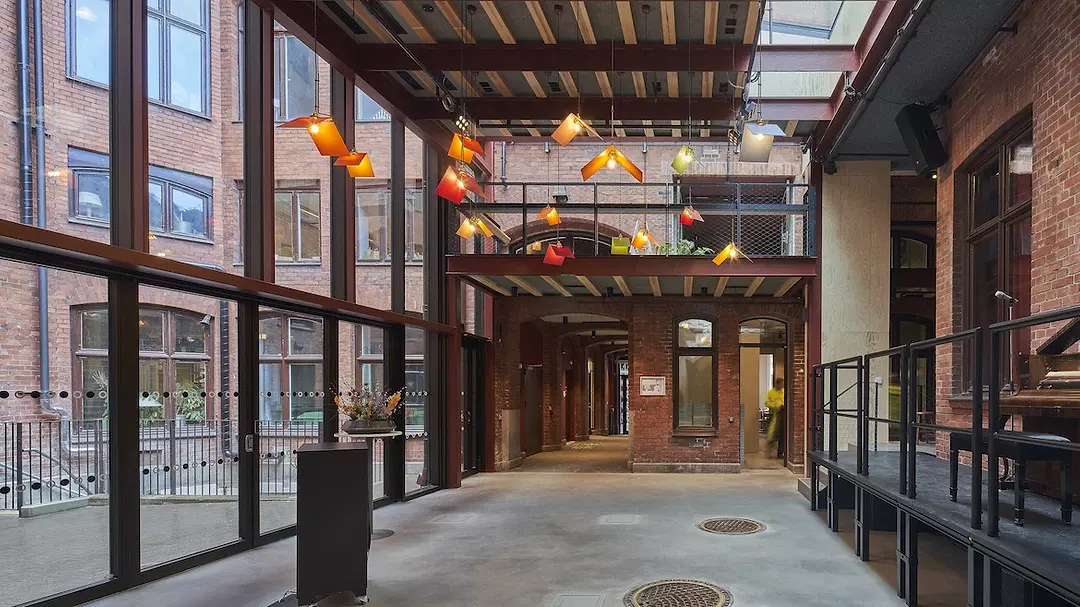 interior view of a large glass-walled room facing a courtyard