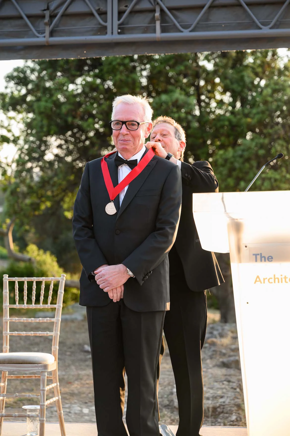 architect david chipperfield being presented with an award.
