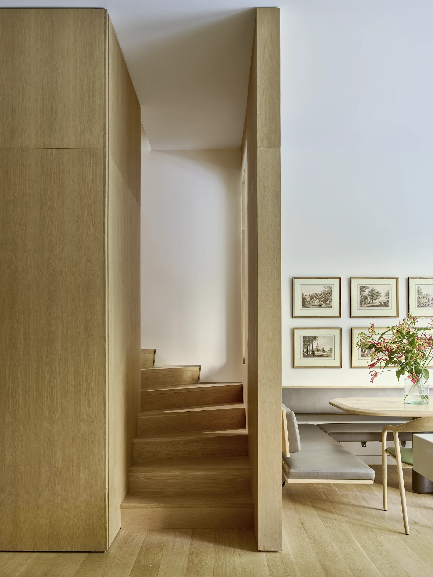 Image of dining table and stairwell.