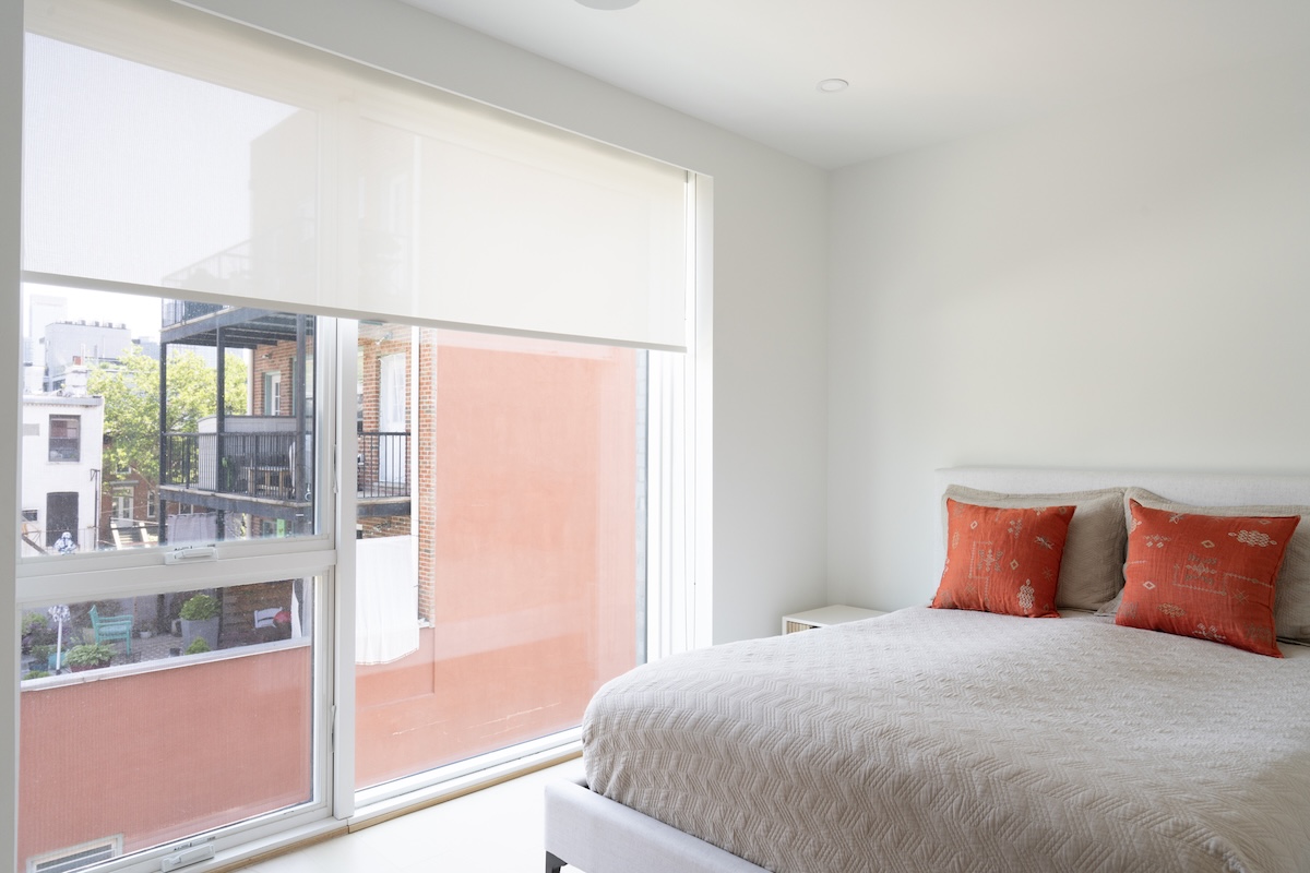Image of primary bedroom within home office.