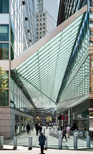 A glass-and-steel canopy by Preston Scott Cohen covers an alley between the Goldman Sachs headquarters by Pei Cobb Freed and the Conrad New York, a collaborative design effort.