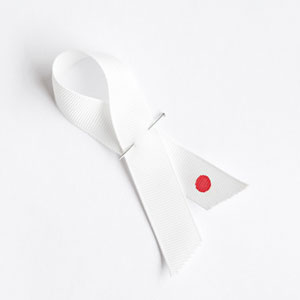 London-based architect John Pawson has created a white ribbon marked with a red circle, akin to Japan’s flag.