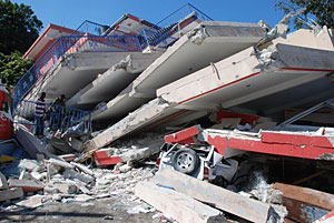 Collapsed two-, or possibly three-story reinforced concretebuilding in Port-au-Prince, Haiti.